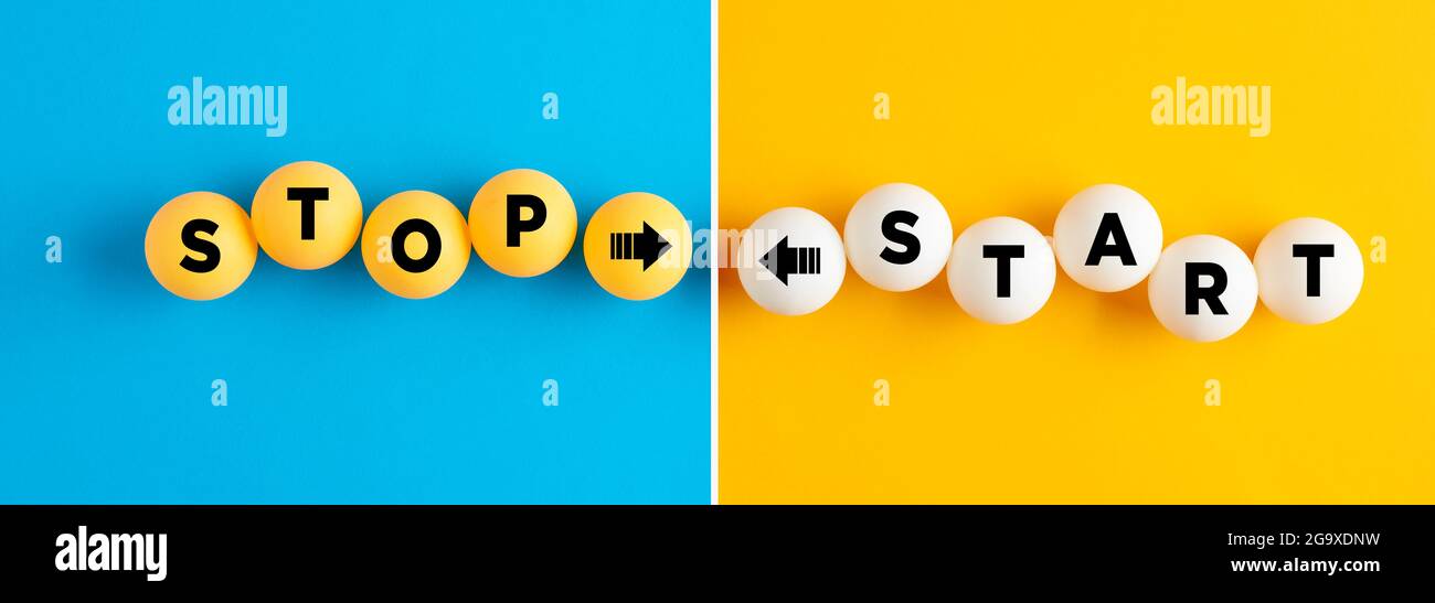The words start and stop written on table tennis balls on blue and yellow background. Stock Photo