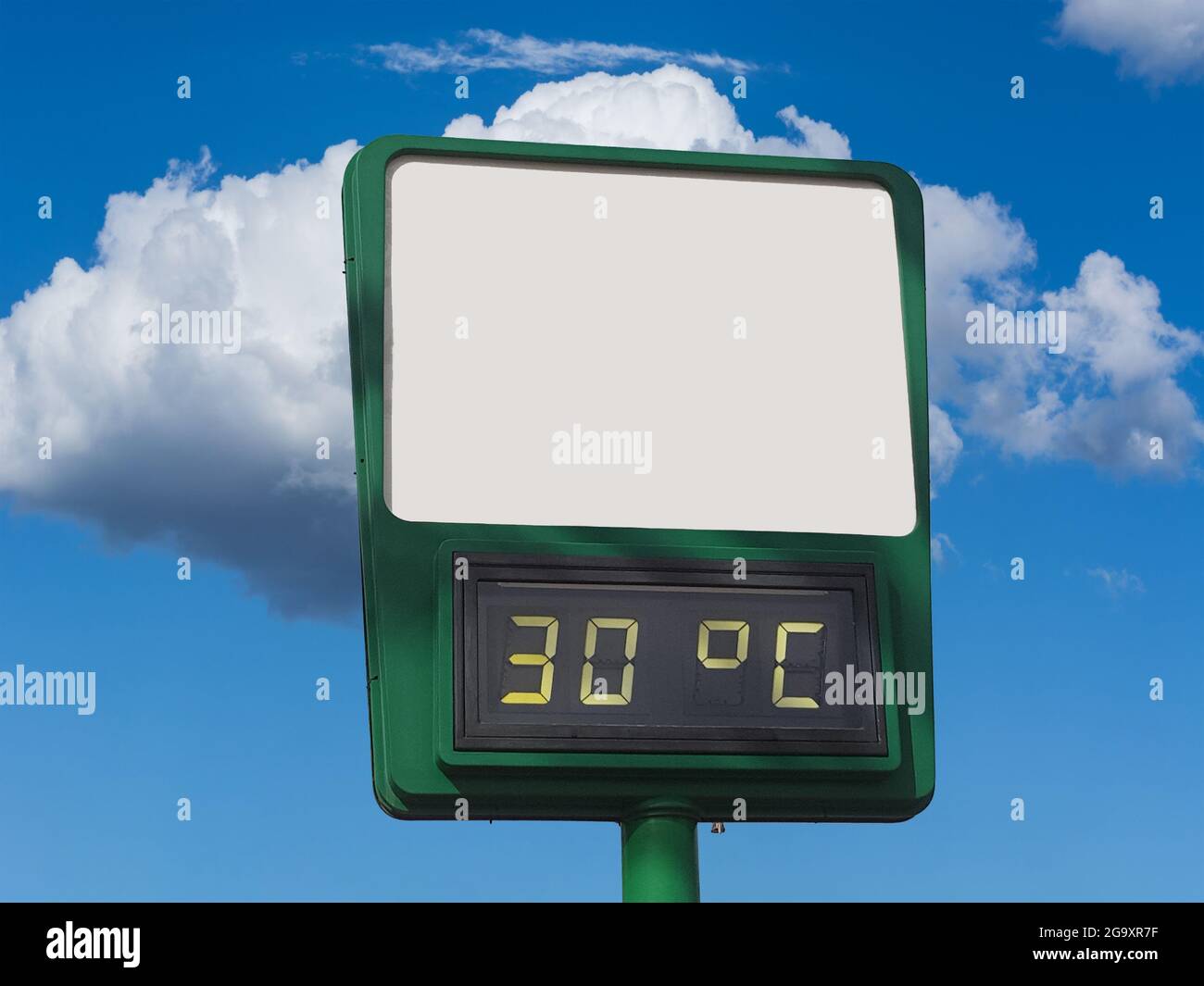Electronic large thermometer on the building, indicating a high summer air  temperature 30 degrees Celsius. Summer hot weather, heat Stock Photo - Alamy