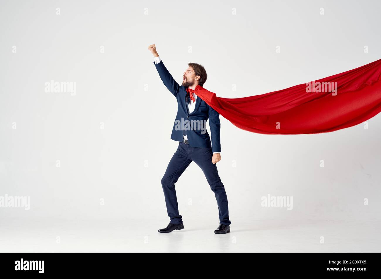 business man in suit red cloak power superhero city defense Stock Photo ...