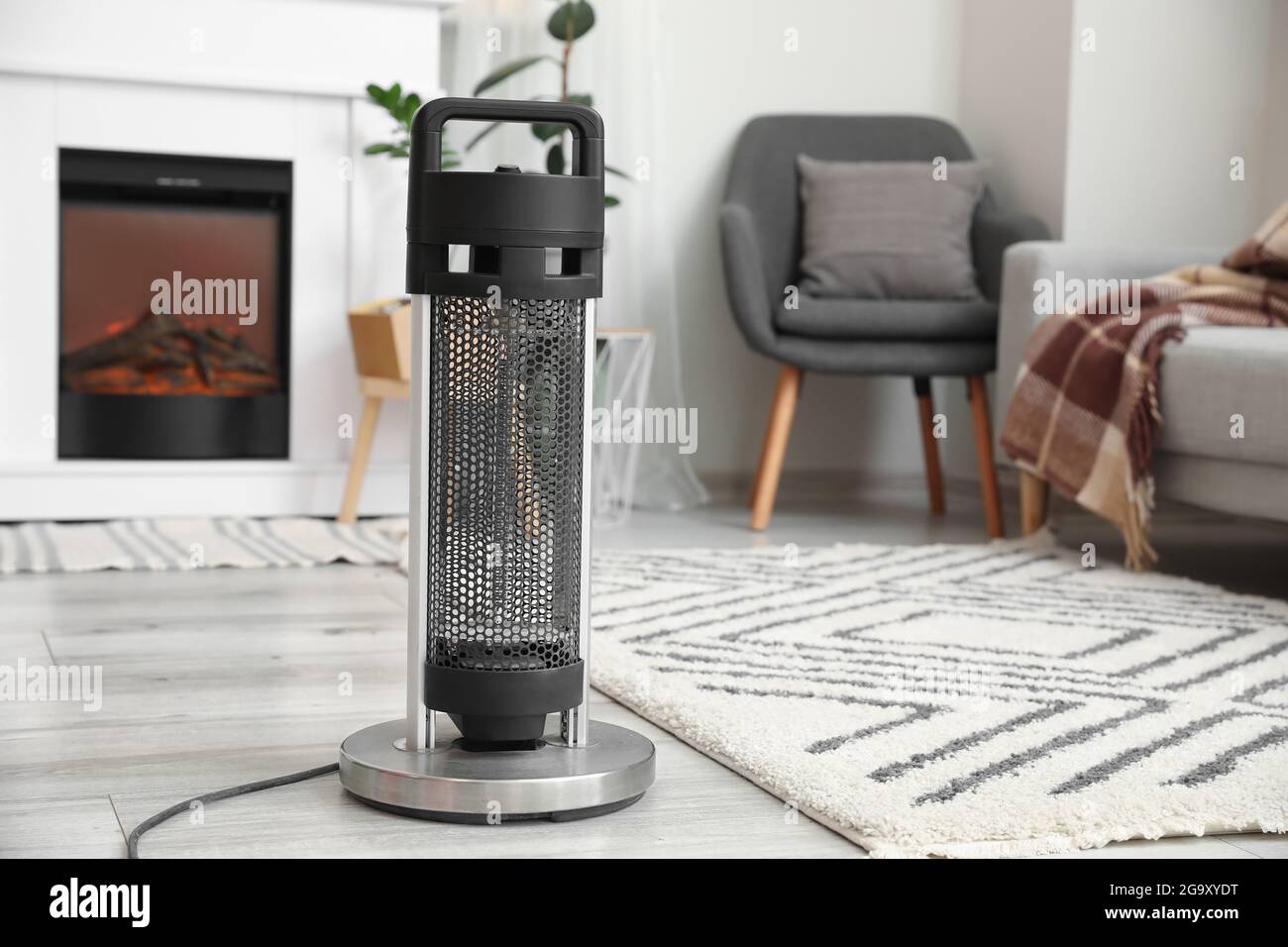 Electric heater in room. Concept of heating season Stock Photo - Alamy