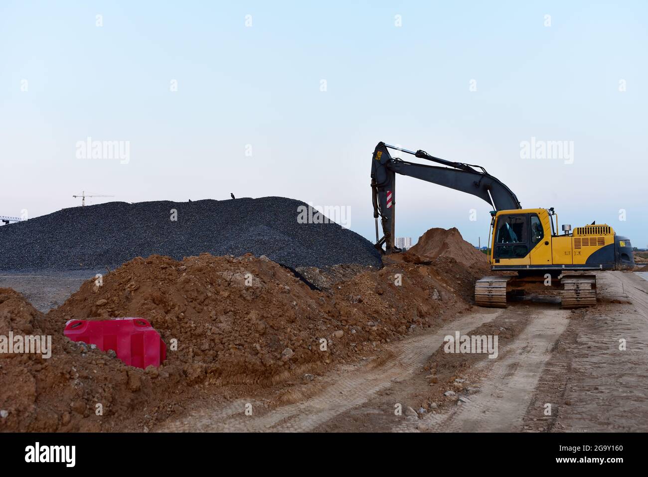 Excavator on earthworks at construction site. Backhoe on earthmoving ...
