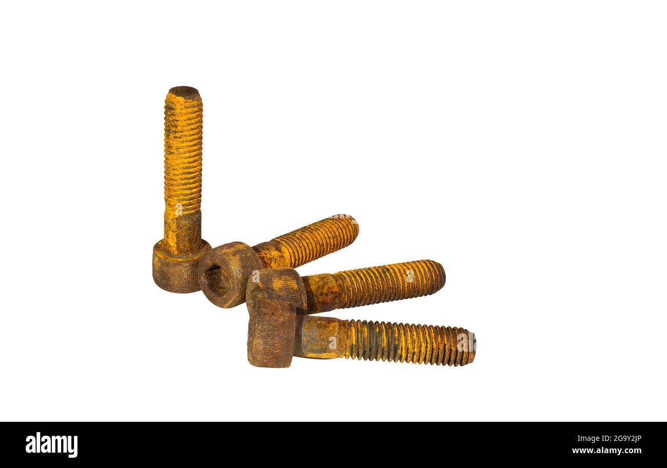 Old and rusty socket head screws stacked together on white background. Clipping path. Stock Photo