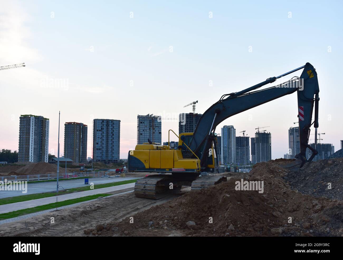 Excavator on earthworks at construction site. Backhoe on earthmoving ...