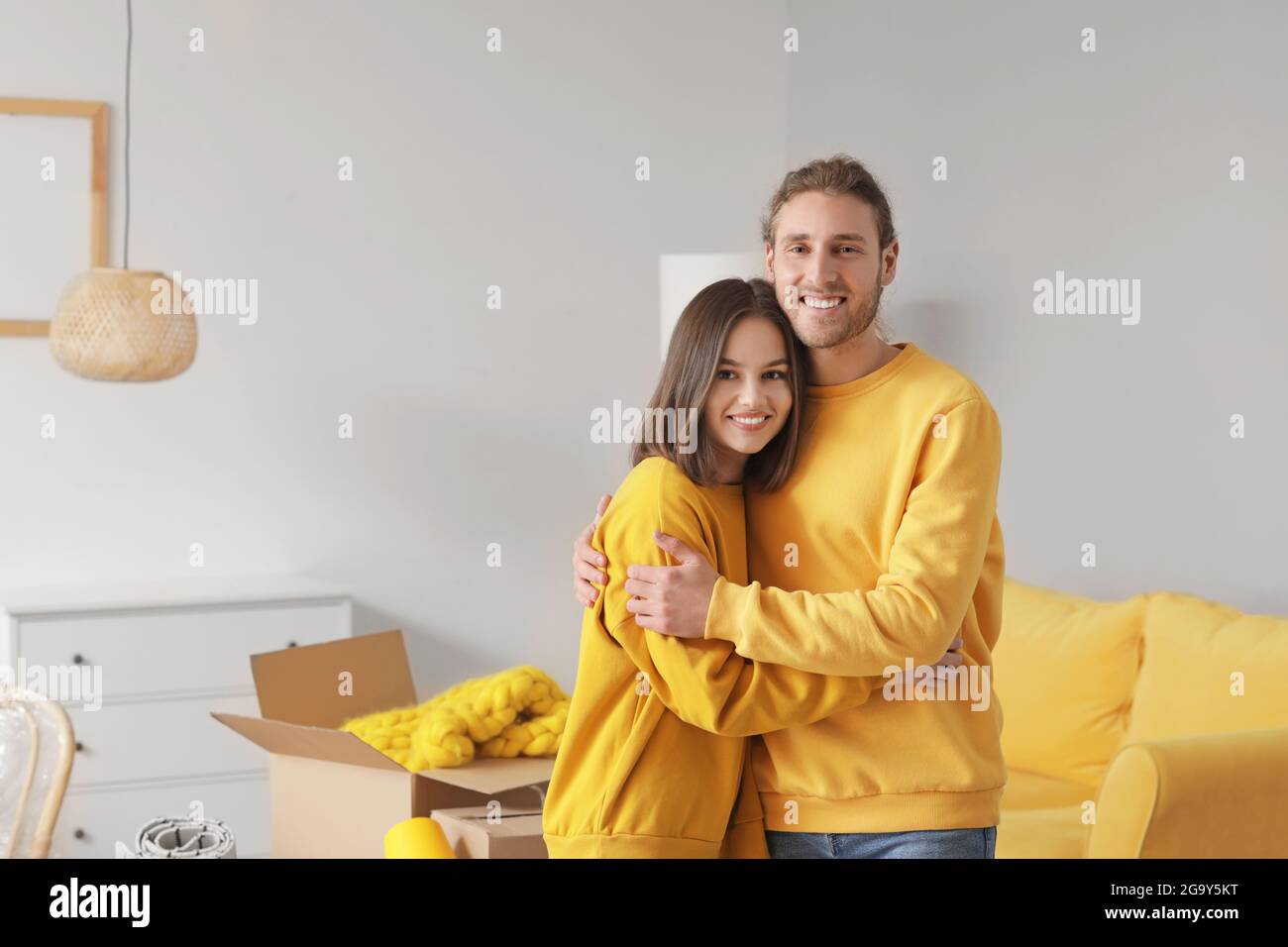 Young couple in their new house on moving day Stock Photo - Alamy