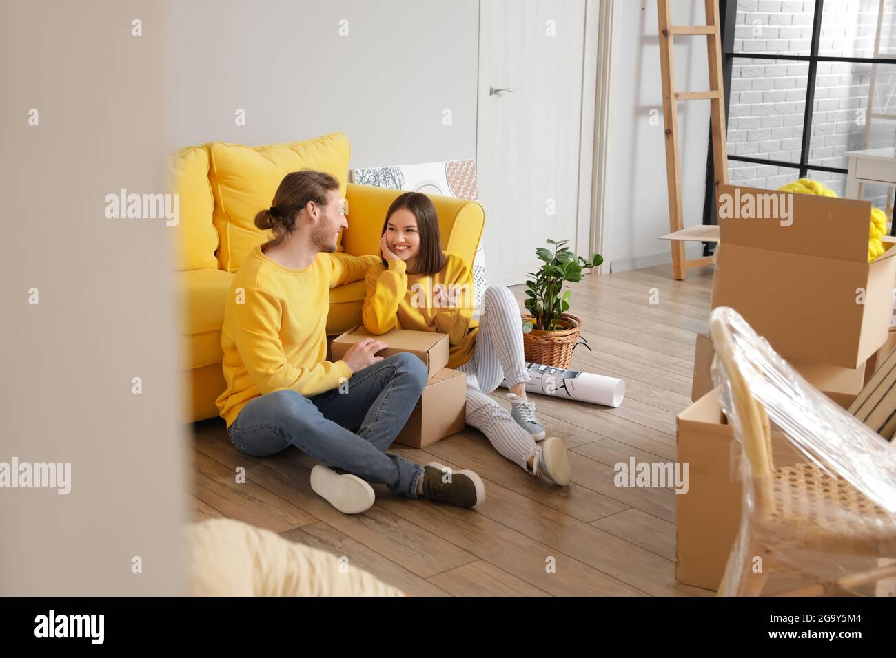 Young couple in their new house on moving day Stock Photo - Alamy