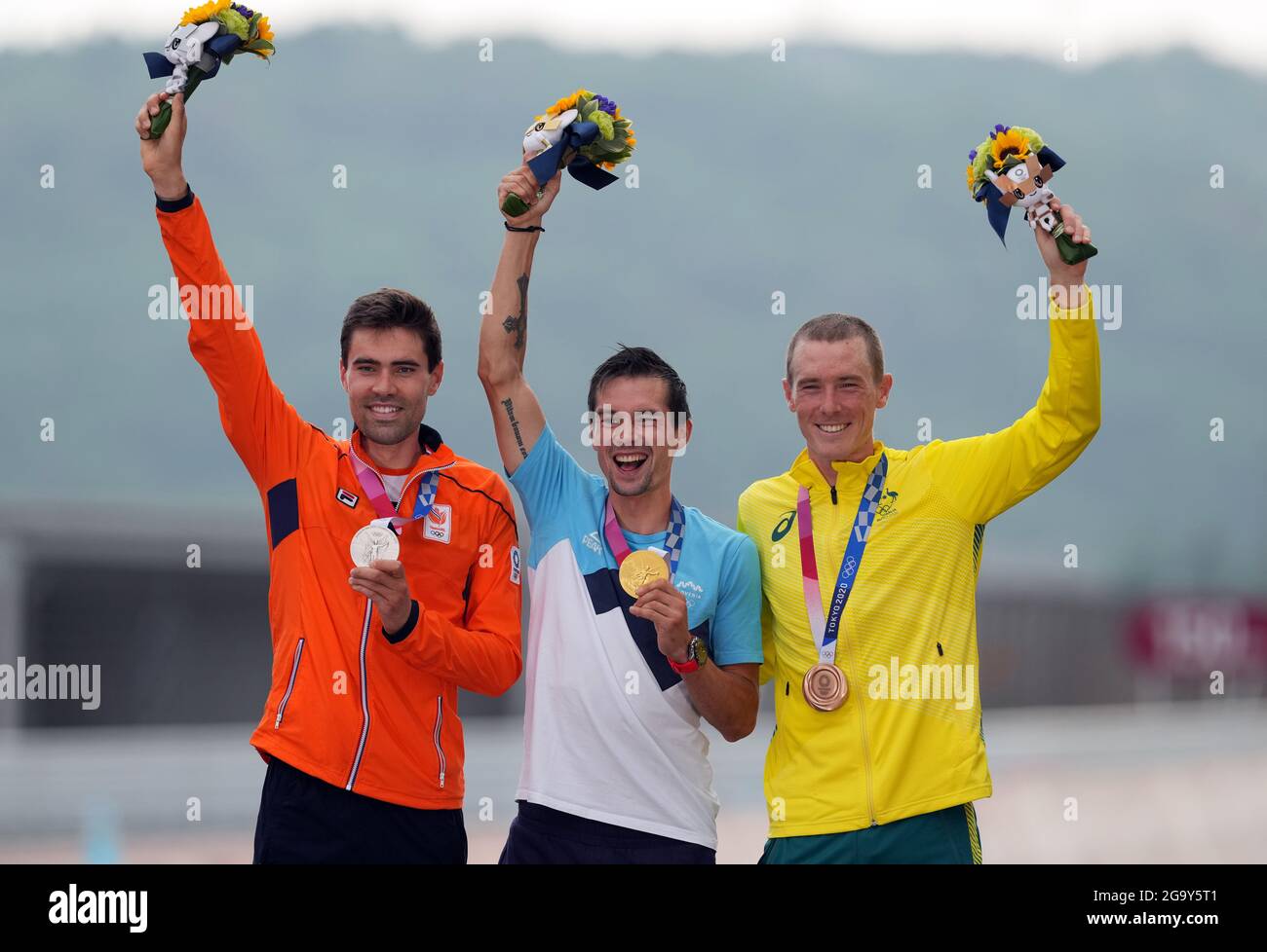 Slovenia's Primoz Roglic celebrates winning Gold (centre), Netherland's Tom Dumoulin celebrates winning Silver (left) and Australia's Rohan Dennis celebrates winning Bronze during the Men's Individual Time Trial at the Fuji International Speedway on the fifth day of the Tokyo 2020 Olympic Games in Japan. Picture date: Wednesday July 28, 2021. Stock Photo