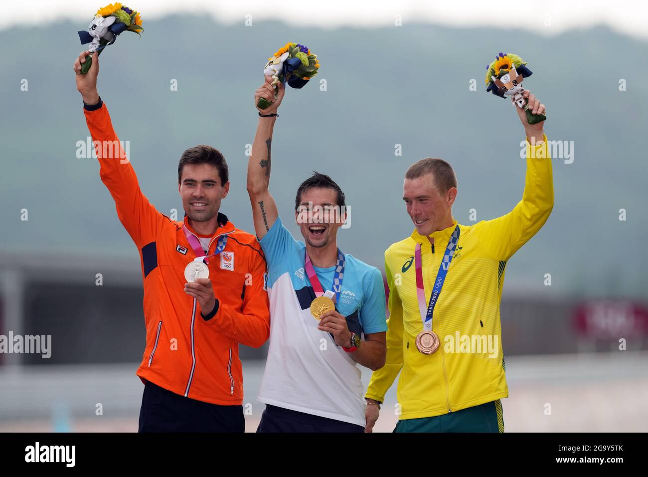 Slovenia's Primoz Roglic celebrates winning Gold (centre), Netherland's Tom Dumoulin celebrates winning Silver (left) and Australia's Rohan Dennis celebrates winning Bronze during the Men's Individual Time Trial at the Fuji International Speedway on the fifth day of the Tokyo 2020 Olympic Games in Japan. Picture date: Wednesday July 28, 2021. Stock Photo