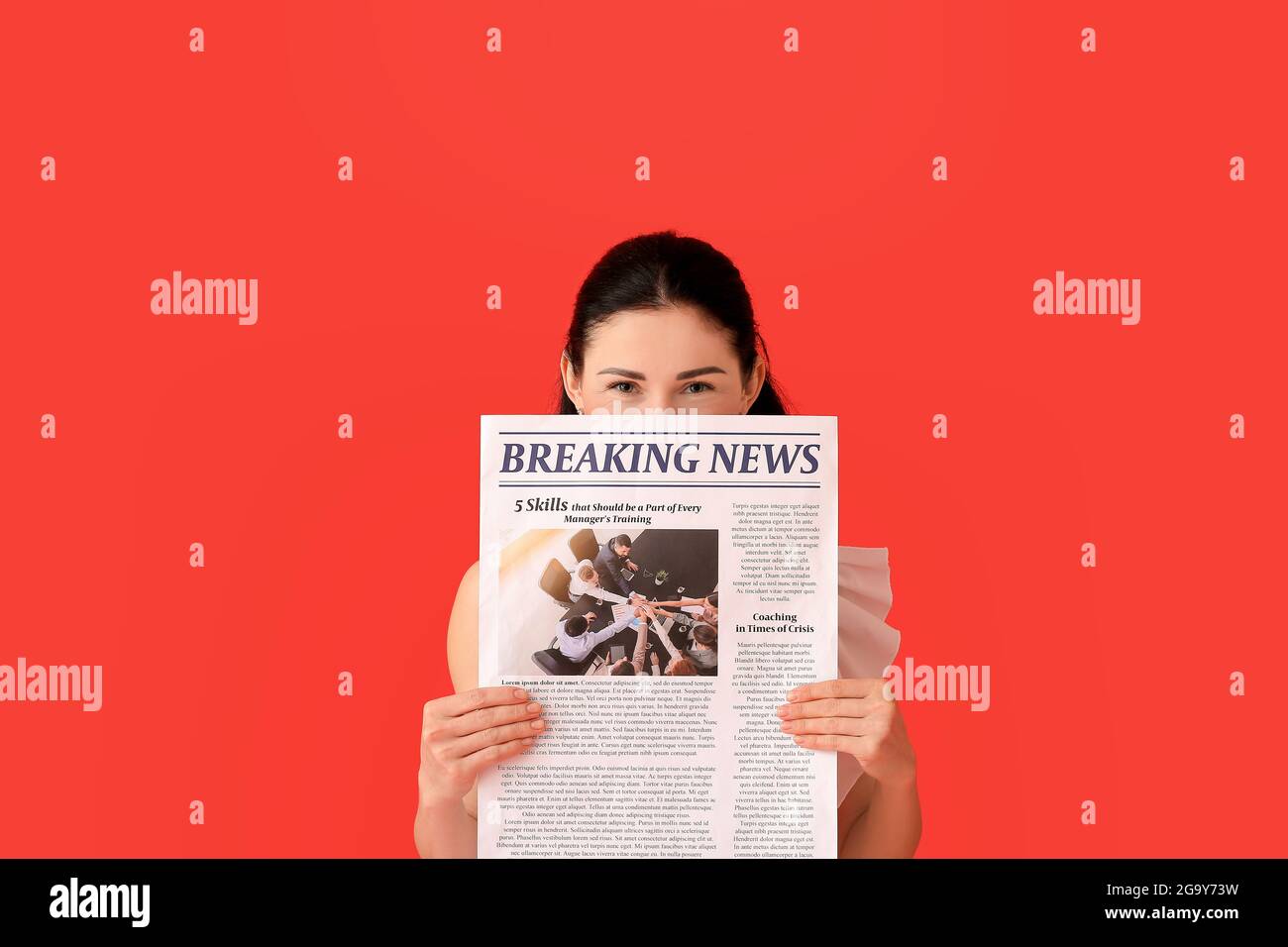 Beautiful woman with newspaper on color background Stock Photo