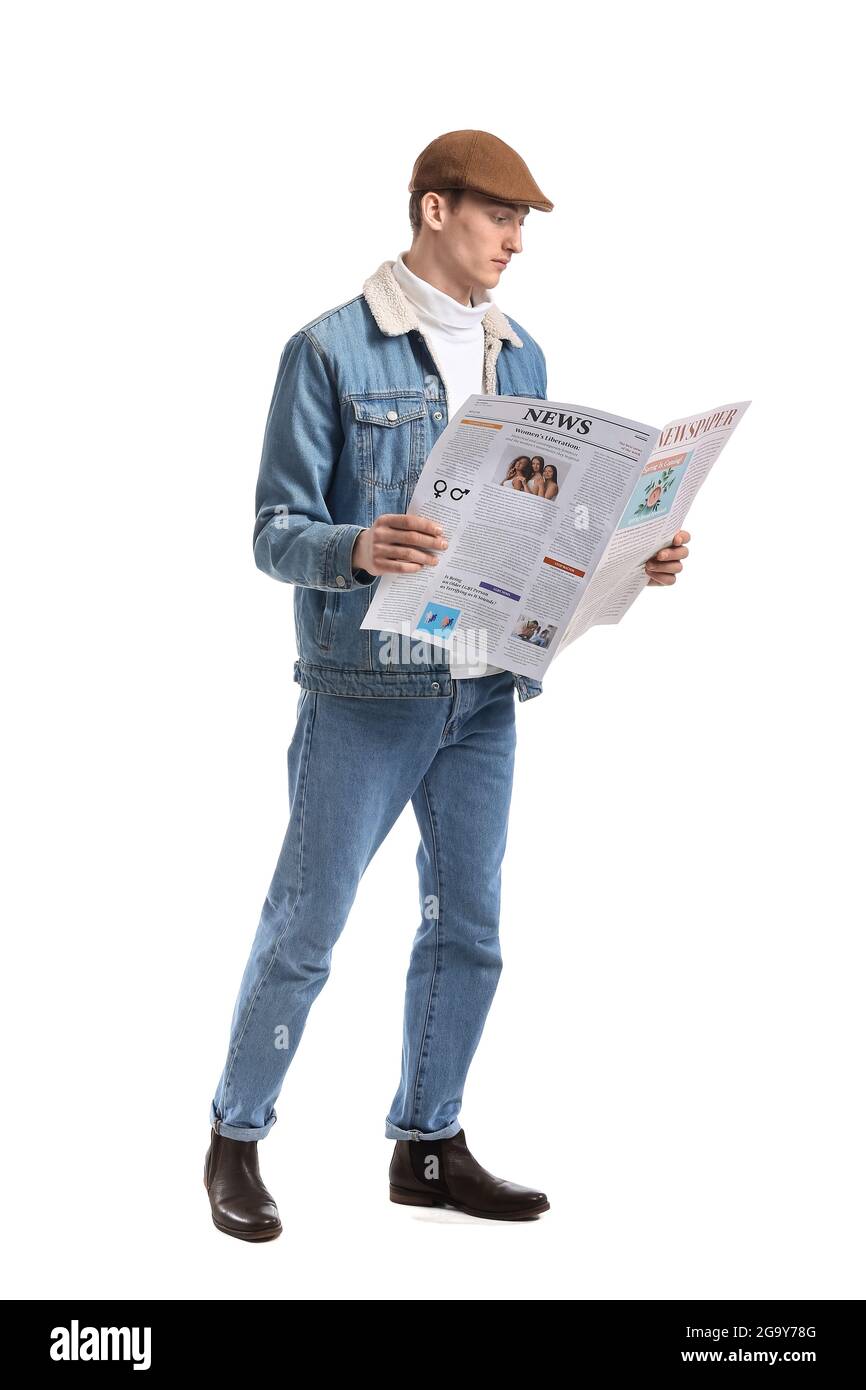 Young man reading newspaper on white background Stock Photo - Alamy