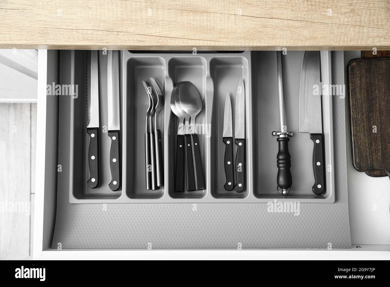 Drawer with set of knives in kitchen Stock Photo - Alamy