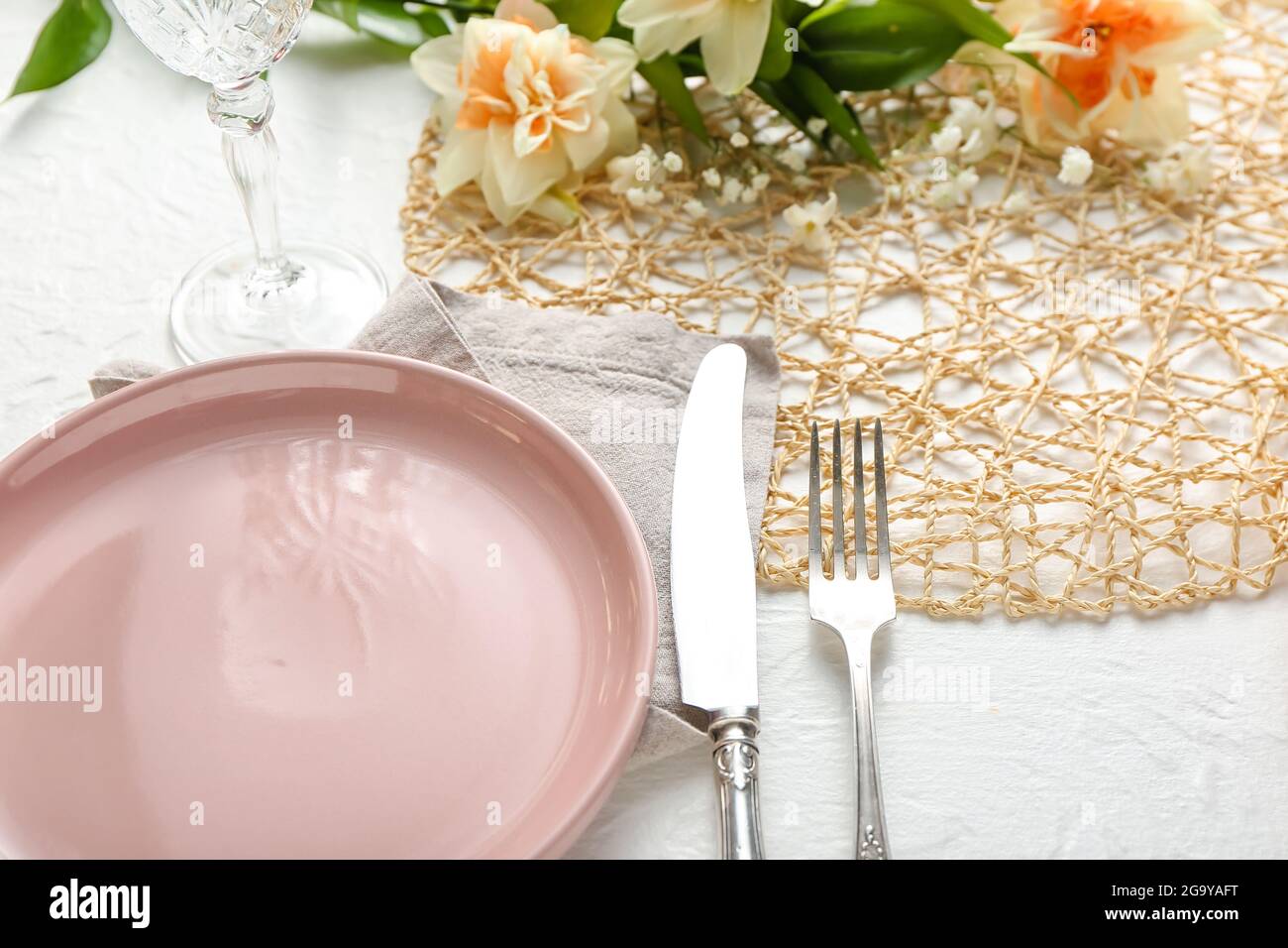 Beautiful table setting on white background Stock Photo - Alamy