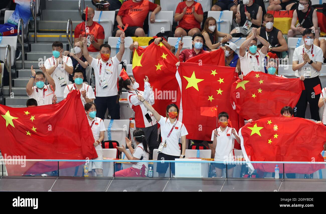 Tokyo, Japan. 28th July, 2021. Athletes and coaches from China congratulate gold medalists Chinese diving athletes Xie Siyi and Wang Zongyuan after the diving men's synchronised 3m springboard final at the Tokyo 2020 Olympic Games in Tokyo, Japan, July 28, 2021. Credit: Ding Xu/Xinhua/Alamy Live News Stock Photo