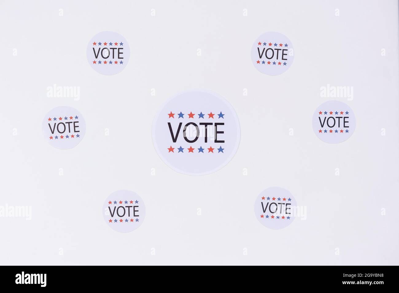 Vote stickers on a white surface in white background Stock Photo - Alamy