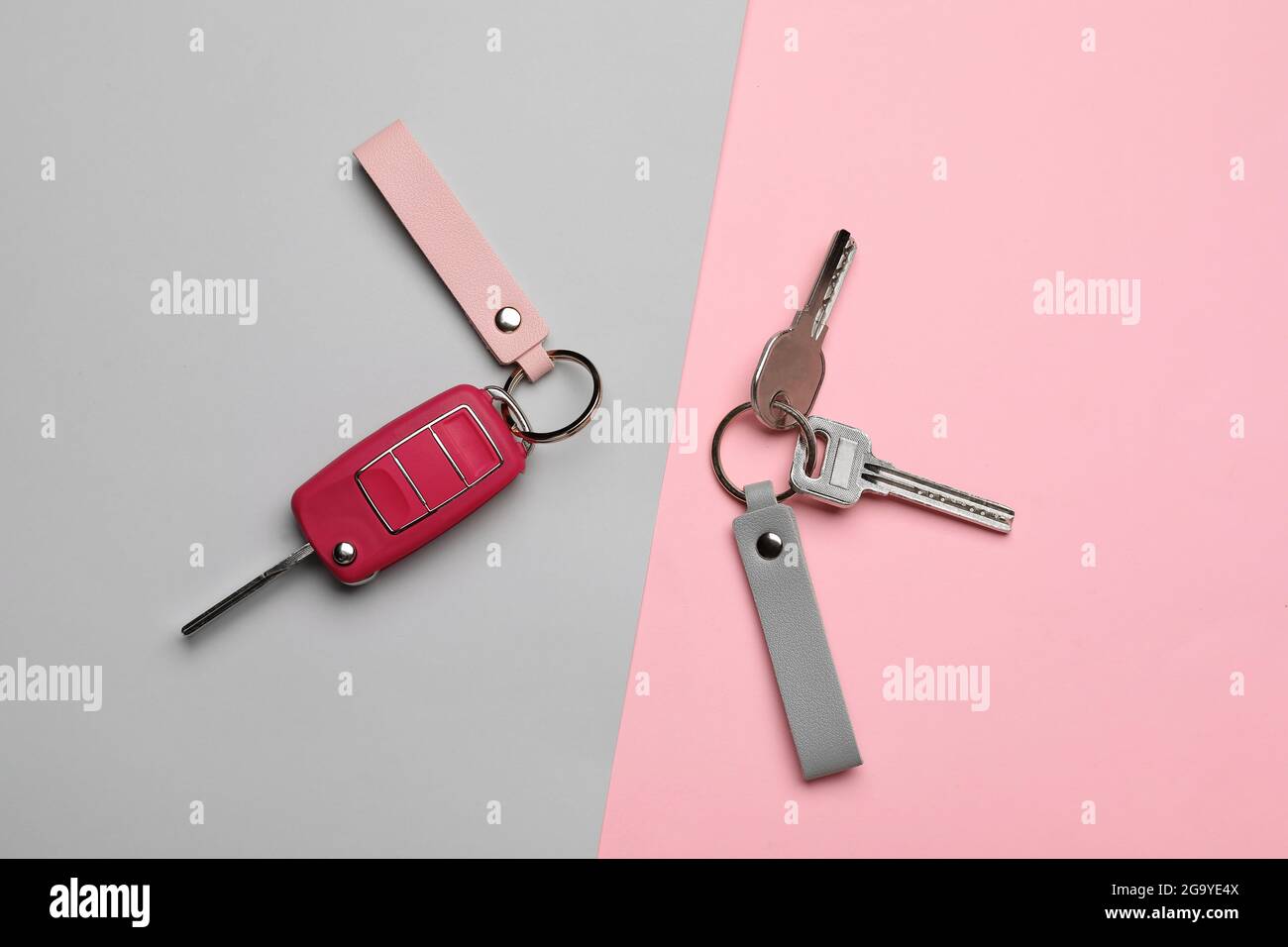 Keys with leather keychains on color background Stock Photo