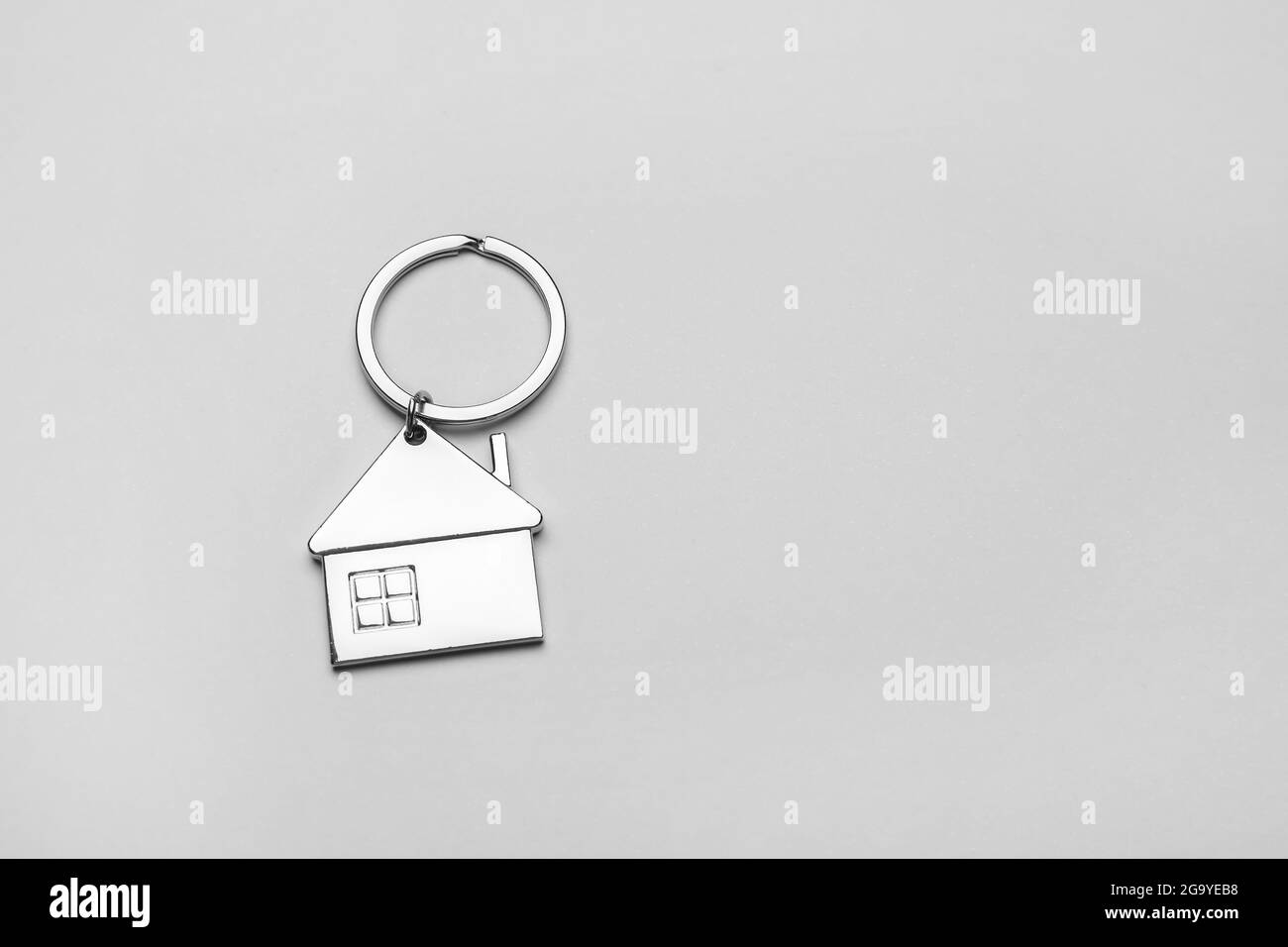 House shape keychain on grey background Stock Photo - Alamy