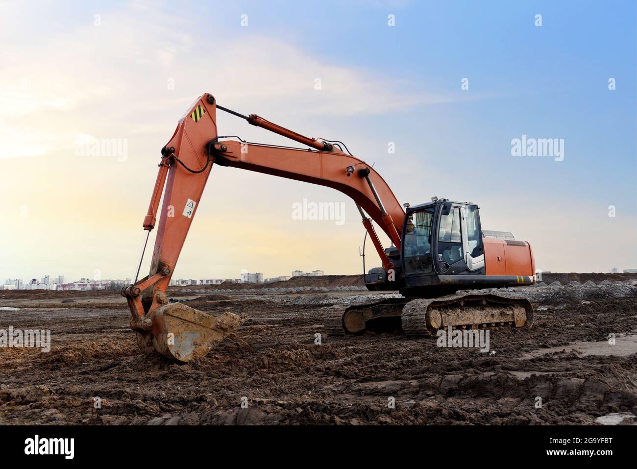 Excavator on earthworks at construction site. Backhoe on earthmoving ...