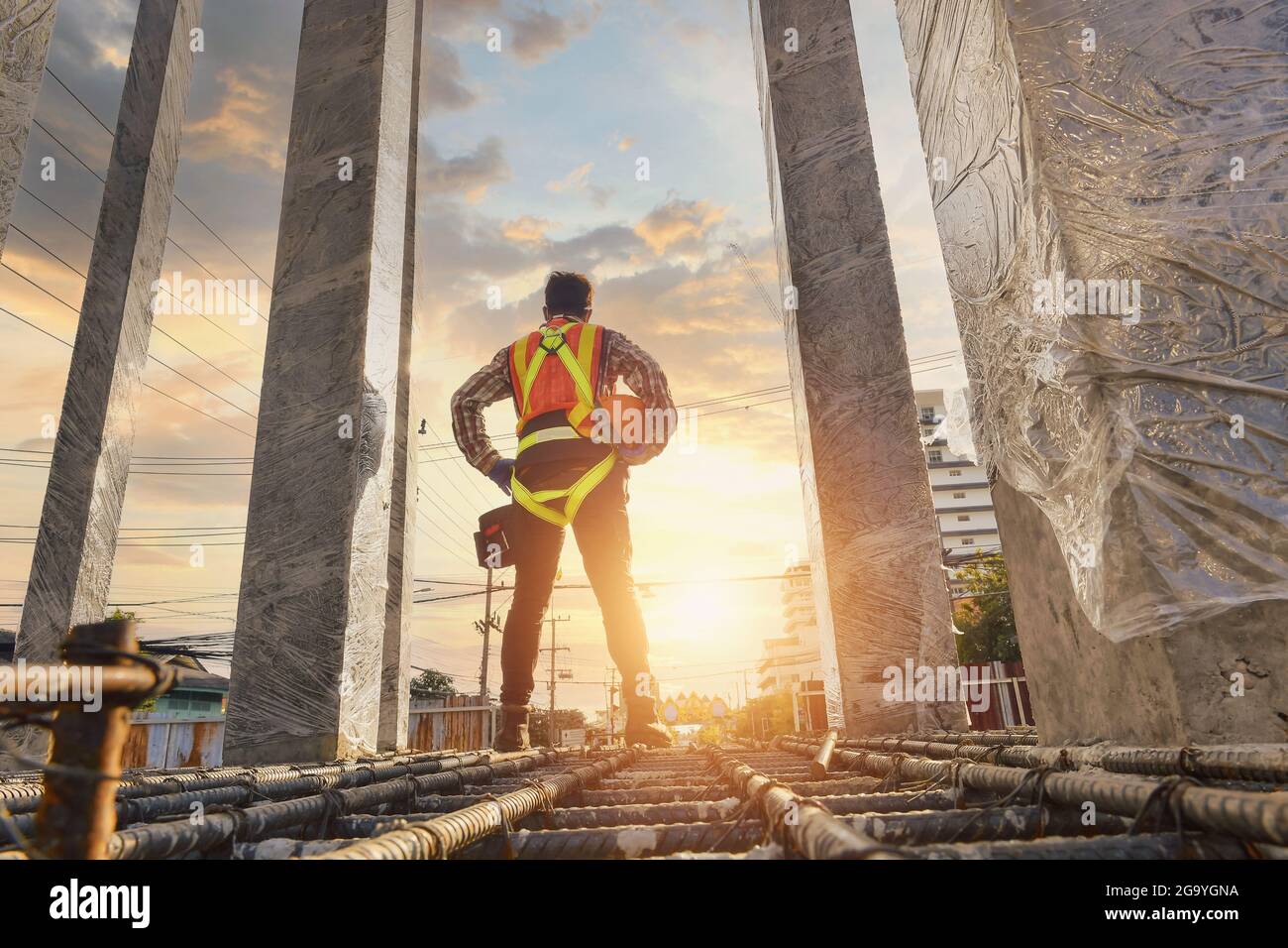 Rear view of a man on a building site, Thailand Stock Photo