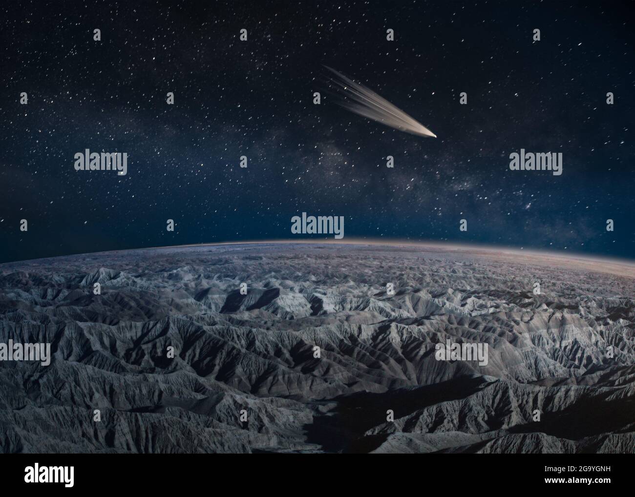 Comet passing over desert badlands, California, USA Stock Photo