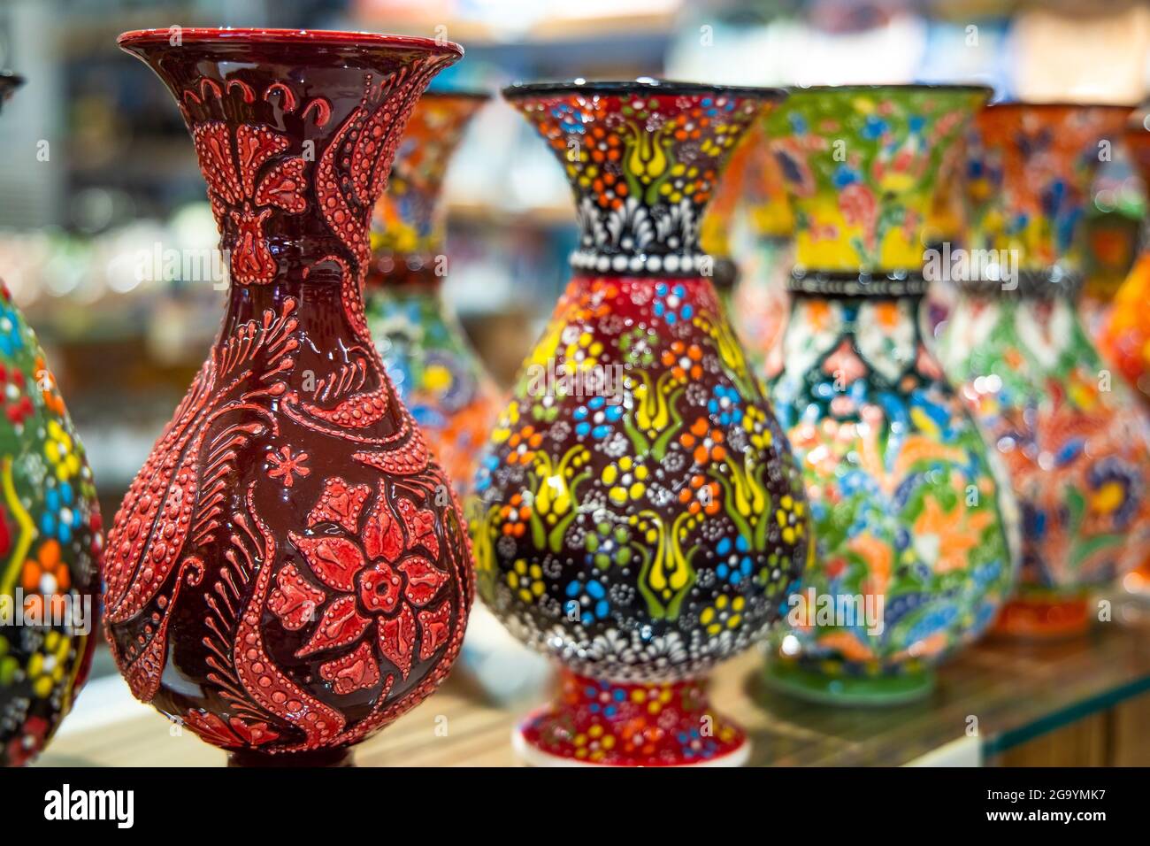 Collection of Colorful traditional Turkish ceramics on sale as souvenirs in the Grand Bazaar in Istanbul, Turkey. Colorful ceramic souvenirs. Stock Photo