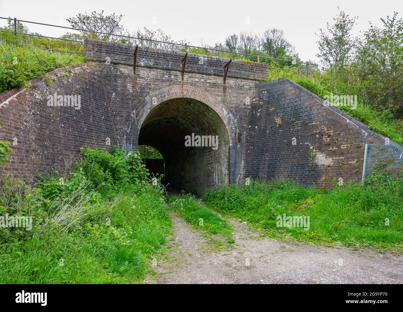 Old brick railway underline train bridge in Amberley, West Sussex, England, UK. Stock Photo