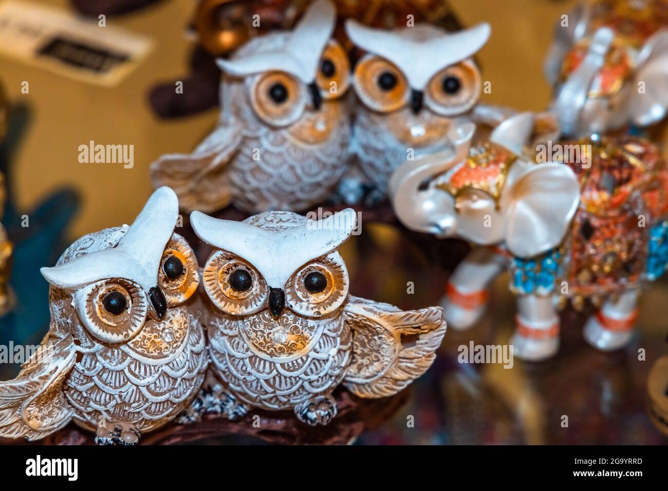 Collection of Porcelain Owl bird Figurine at Gift Shop. Stock Photo