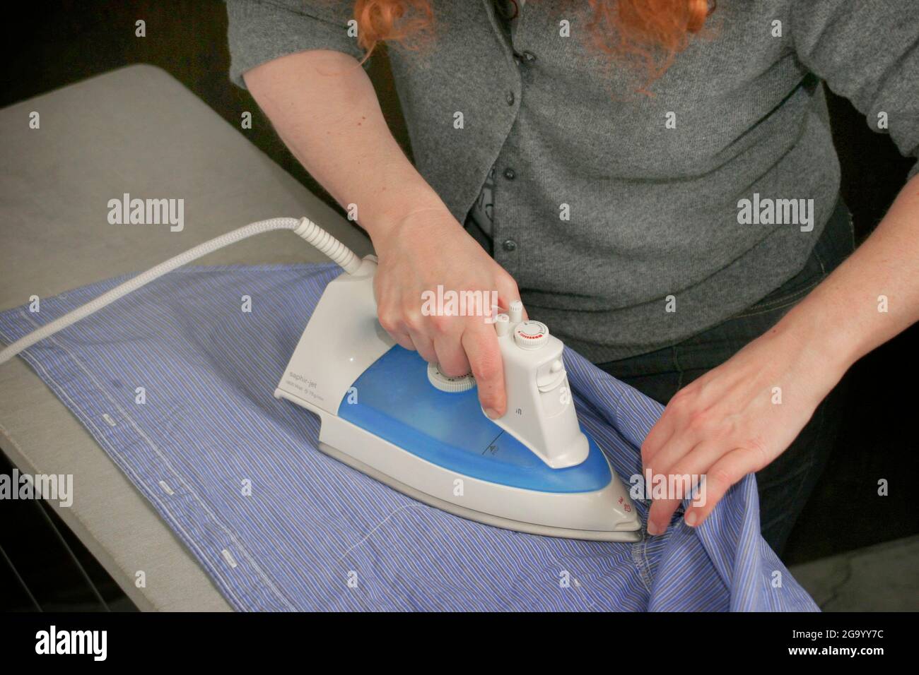 housewife ironing Stock Photo