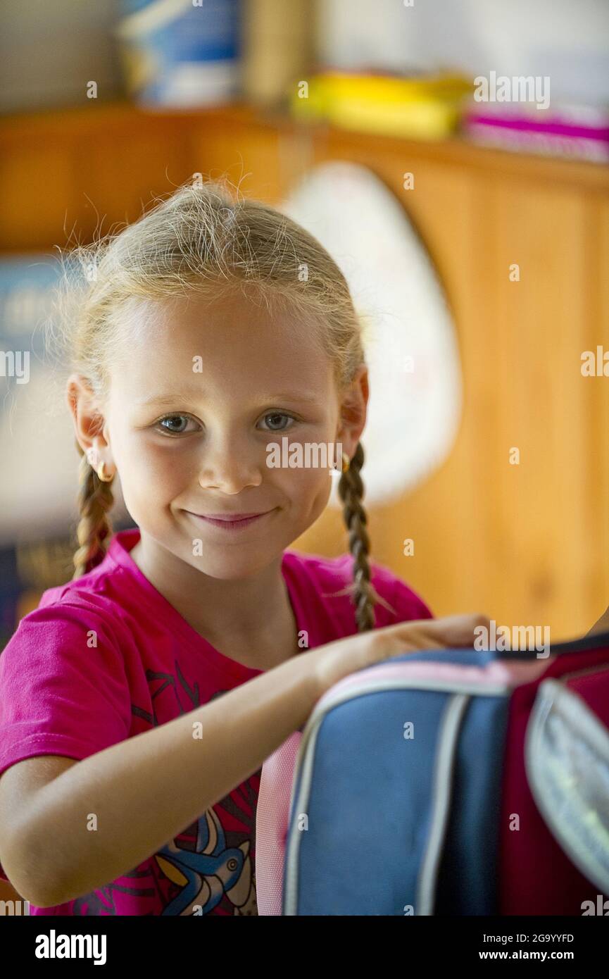 proud female school beginner with satchel , Germany Stock Photo
