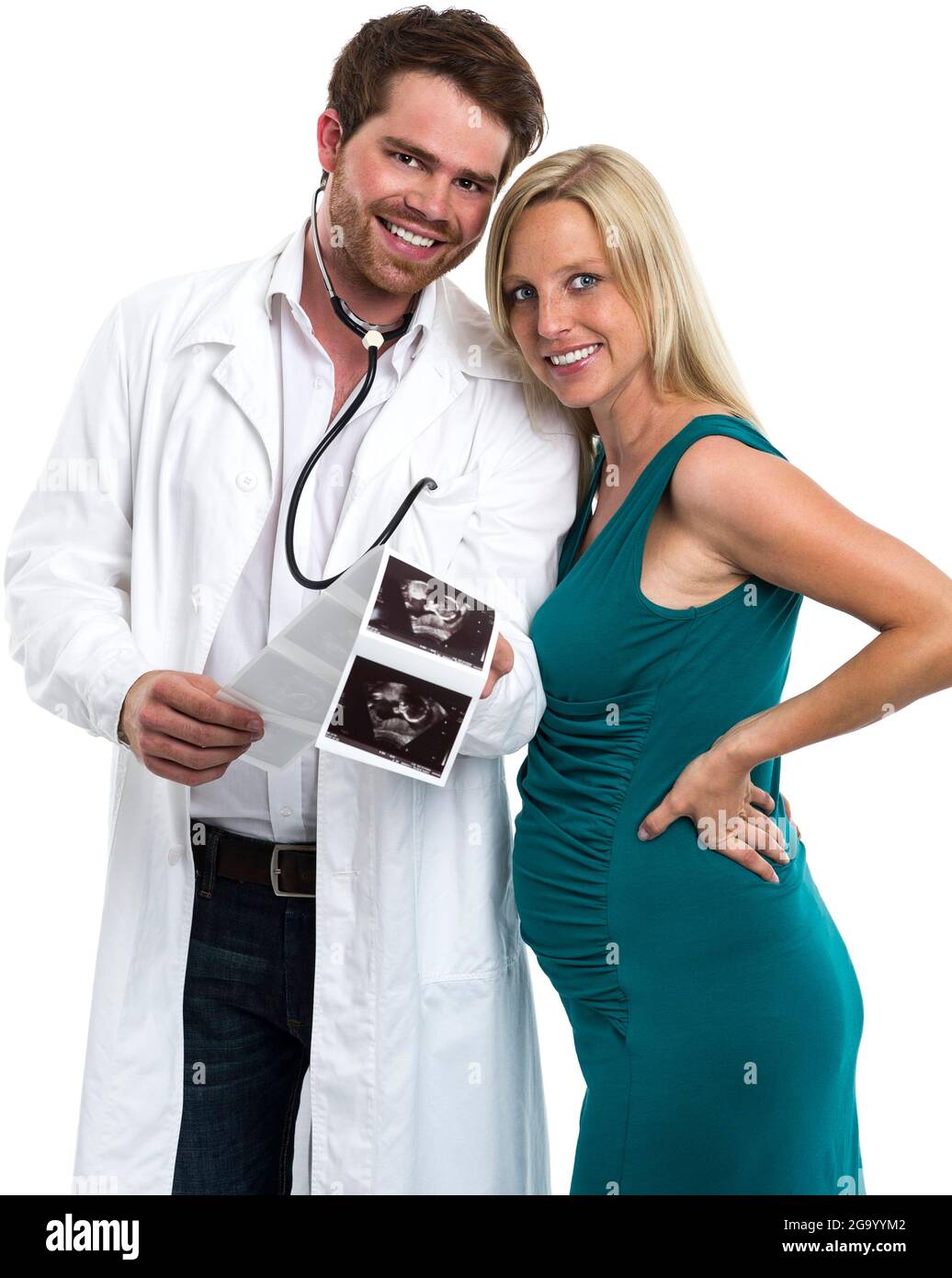 doctor becomes father, happily looking at ultrasound images of unborn baby with pregnant woman , Germany Stock Photo