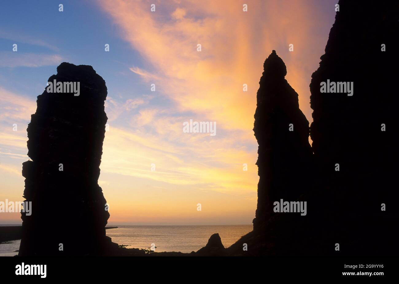 Lange Anne sea stack and the cliffs of Heligoland, silhouette in the evening light, Germany, Schleswig-Holstein, Heligoland Stock Photo