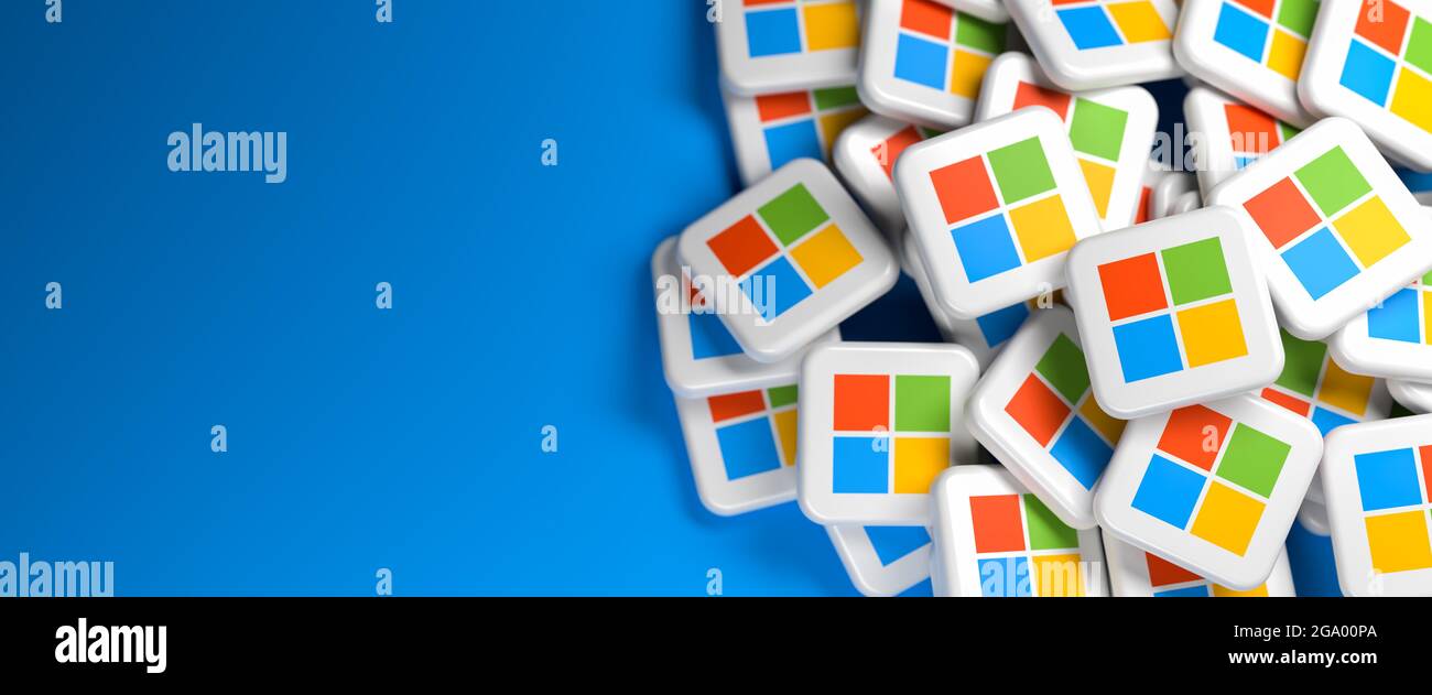 Logos of the tech company Microsoft on a heap. Web banner size with copy space - Selective focus Stock Photo