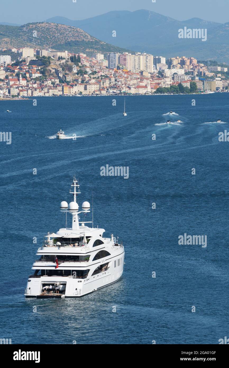 Mega yacht approaching the town of Sibenik on Croatian coast. Luxury, vacation, travel and tourism concepts Stock Photo