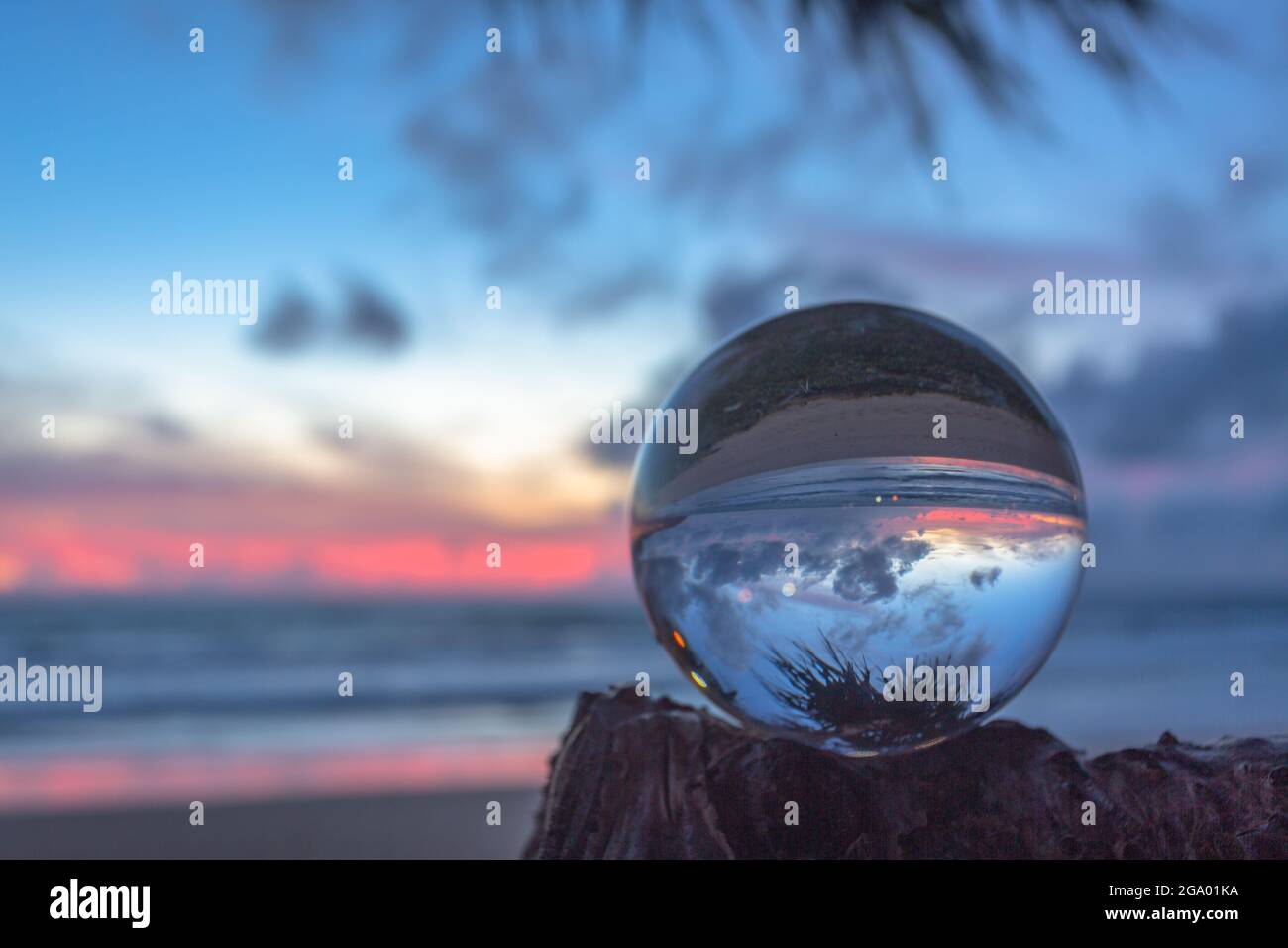 beautiful cloud and golden sunset inside crystal ball placed on a ...