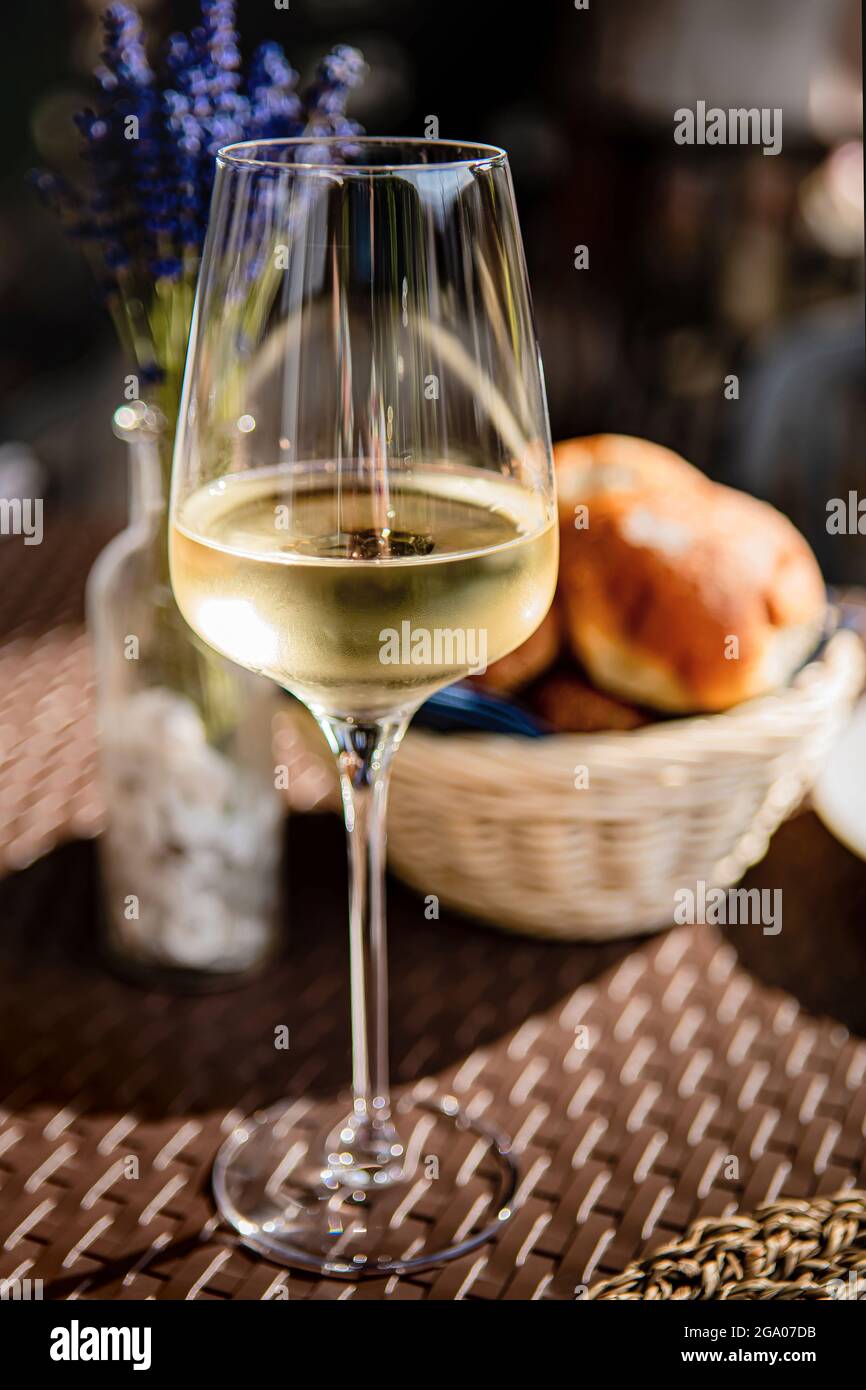 Glass of cold white wine and fresh pastries Stock Photo Alamy