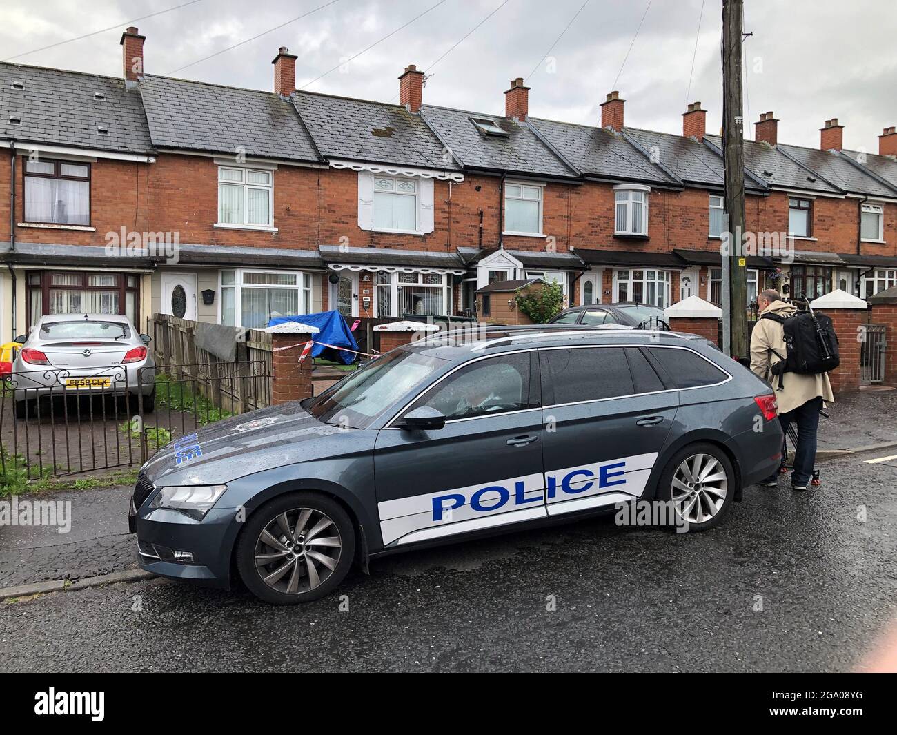 Police at the scene in Brompton Park, Belfast, where a baby died and another young child was critically injured following an incident at a house on Tuesday night. Picture date: Wednesday July 28, 2021. Stock Photo