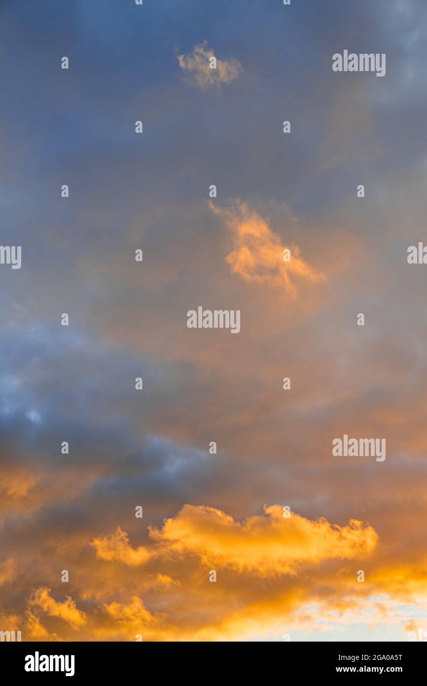 Clouds with orange sunset light Stock Photo