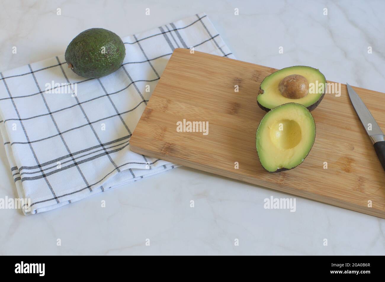 ?loseup of sliced avocado on a wooden board Stock Photo - Alamy