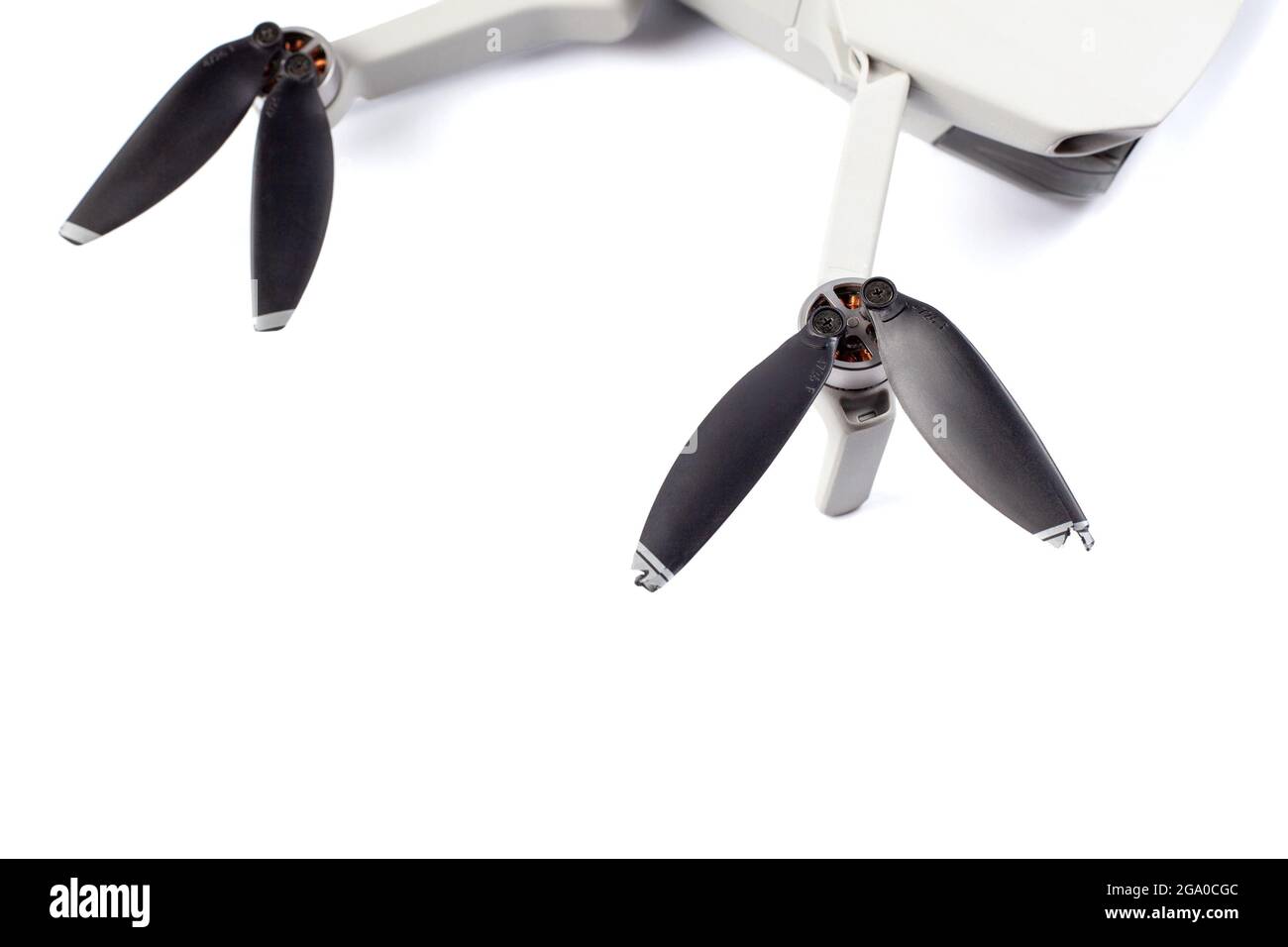 A closeup shot of the broken propellers and brushless motor of a drone