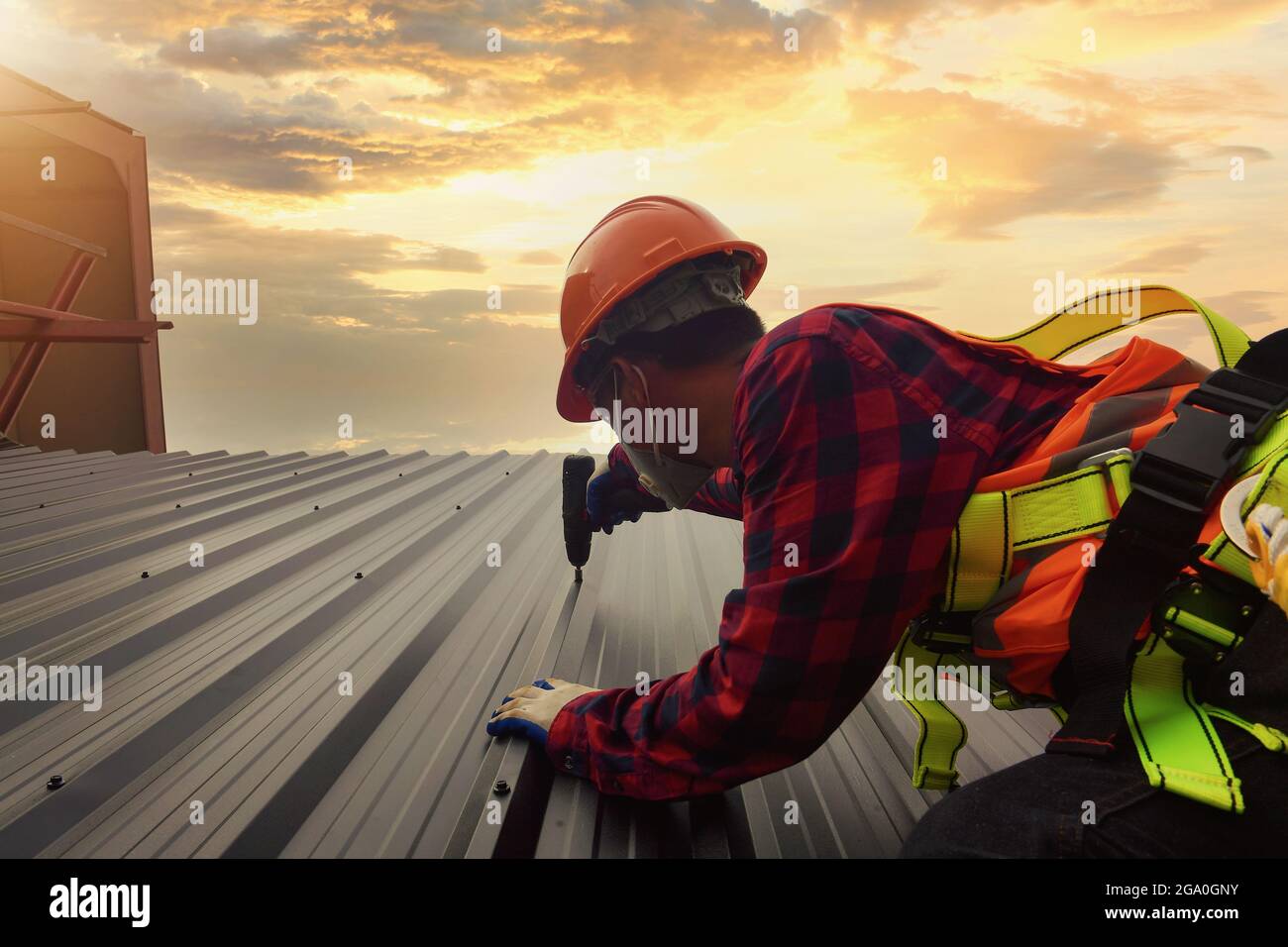 Roofer Construction worker install new roof,Roofing tools,Electric drill used on new roofs with