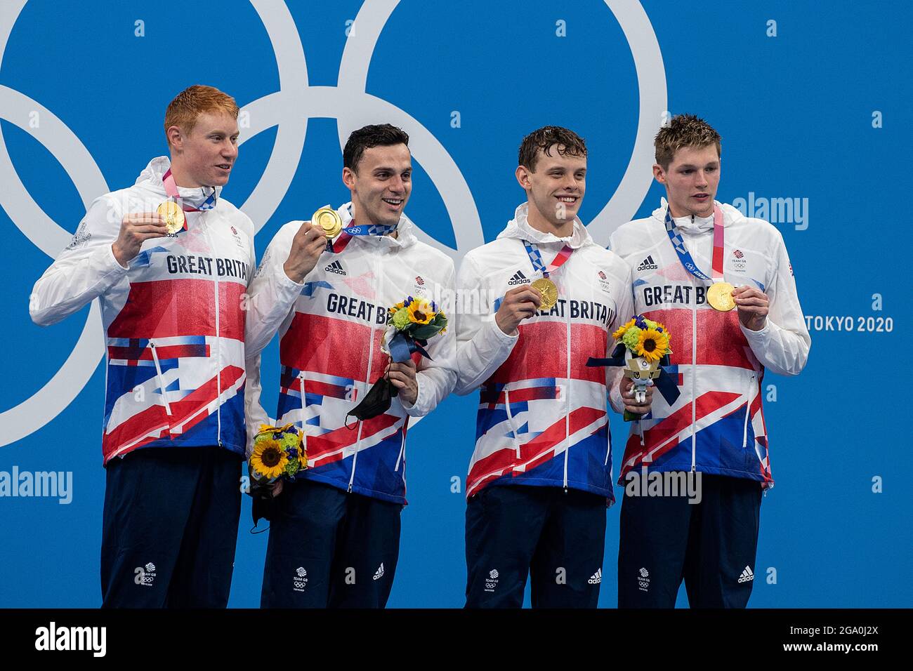 Tokyo, Japan. 28th July, 2021. The British season with the participants Tom DEAN (GBR), James GUY, Matthew RICHARDS and Duncan SCOTT shows their gold medals; 1st place, Olympic champion award ceremony; Final, 4 x 200m freestyle relay, men; Swimming/women/men, on 07/28/2021; Olympic Summer Games 2020, from 23.07. - 08.08.2021 in Tokyo/Japan. Credit: dpa/Alamy Live News Stock Photo