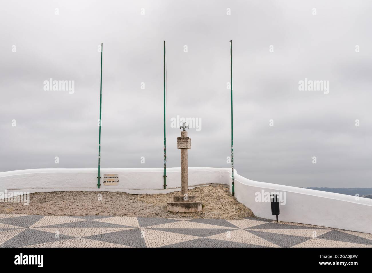 Nazare, Portugal - June 30, 2021: Cross next to the Memory Hermitage on the Miradoura do Suberco viewpoint Stock Photo