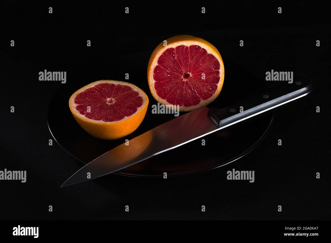 red grapefruit on black background Stock Photo