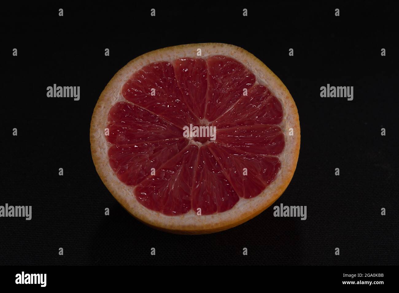 red grapefruit on black background Stock Photo