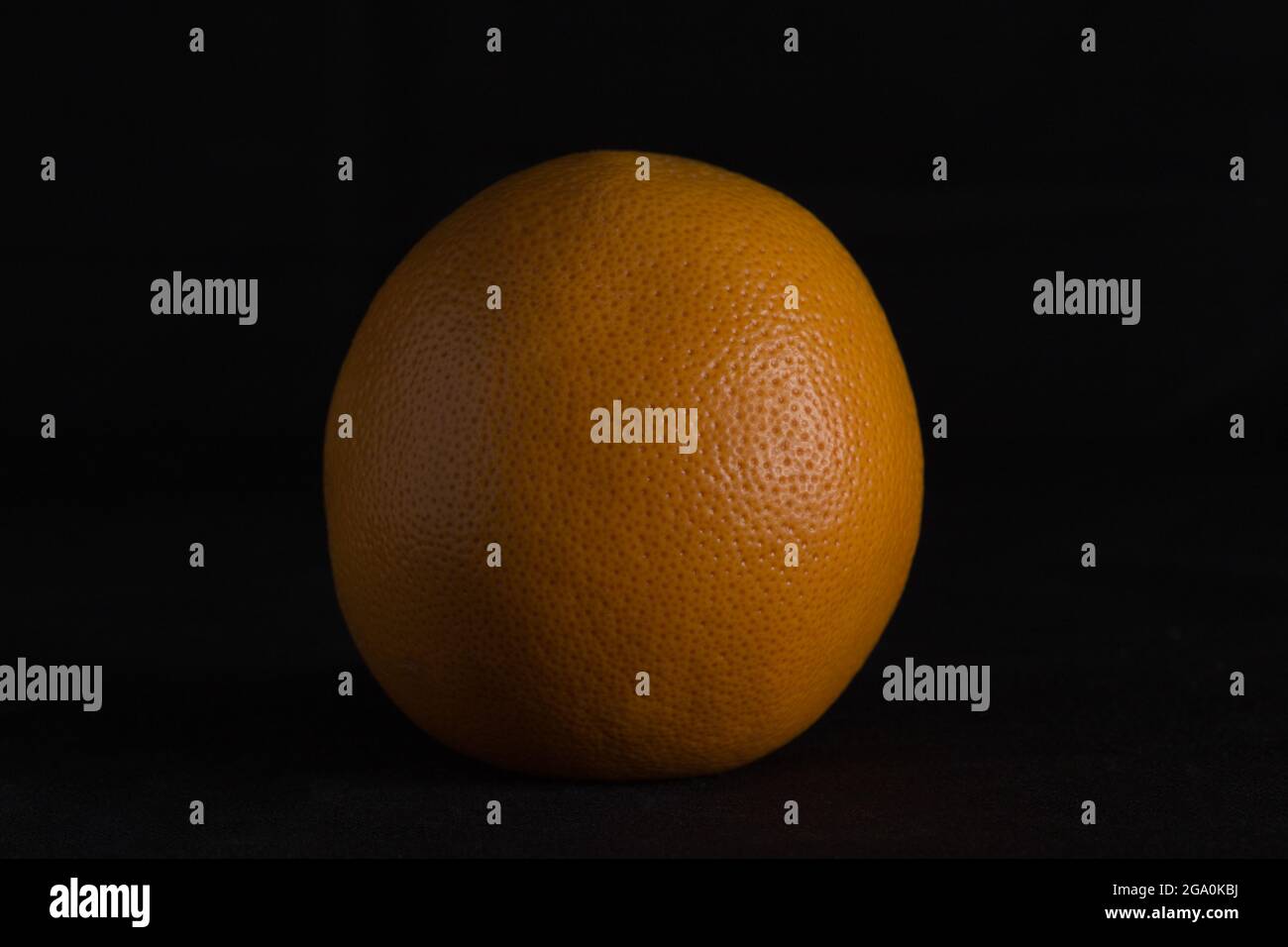 red grapefruit on black background Stock Photo
