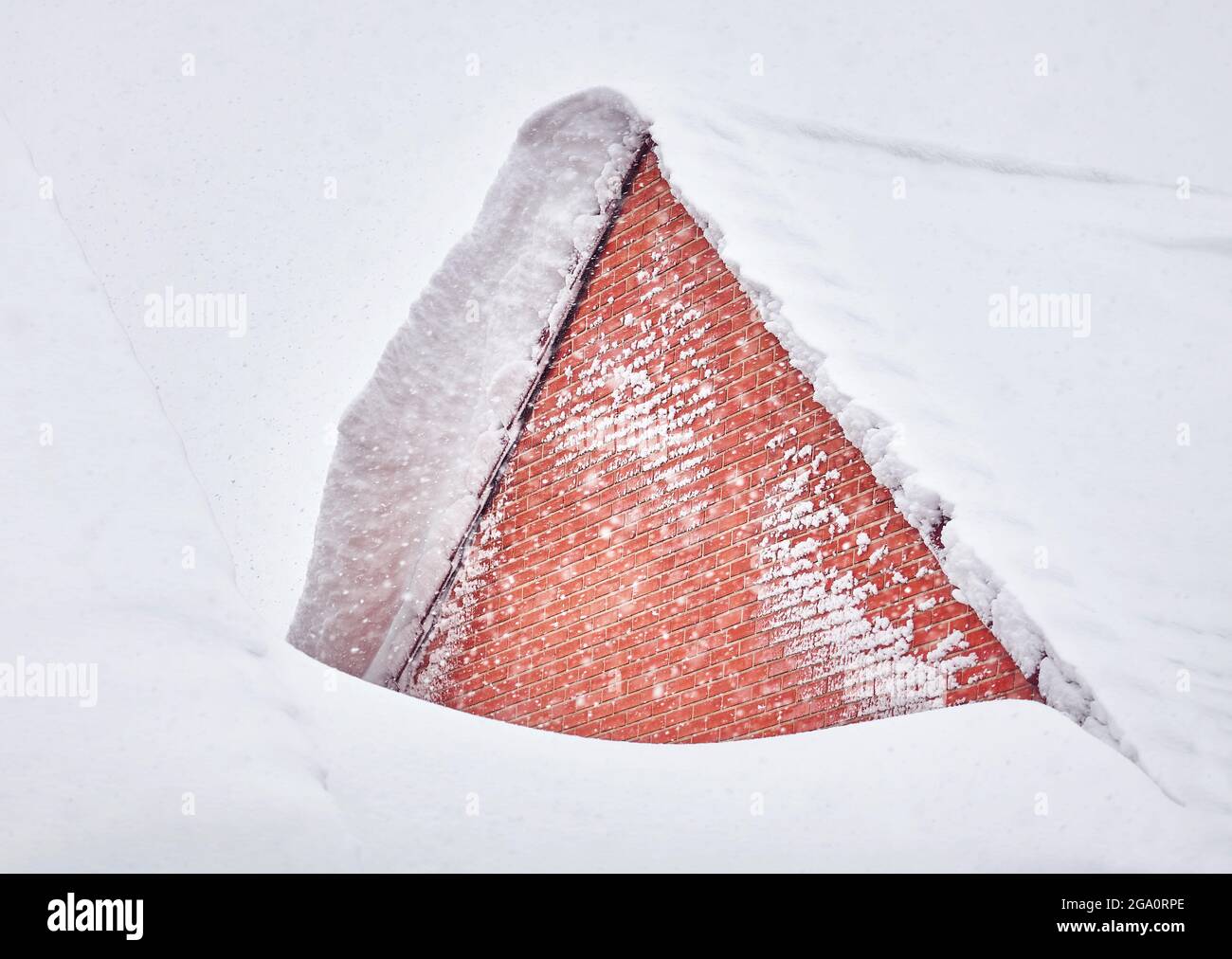 Storm Filomena blankets a pitched roof with heavy snow. Getafe