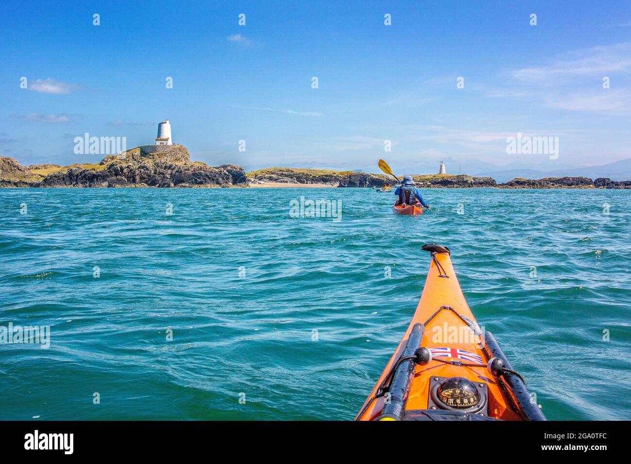 Sea kayaking off the coast of Anglesey at Llanddwyn Island , North