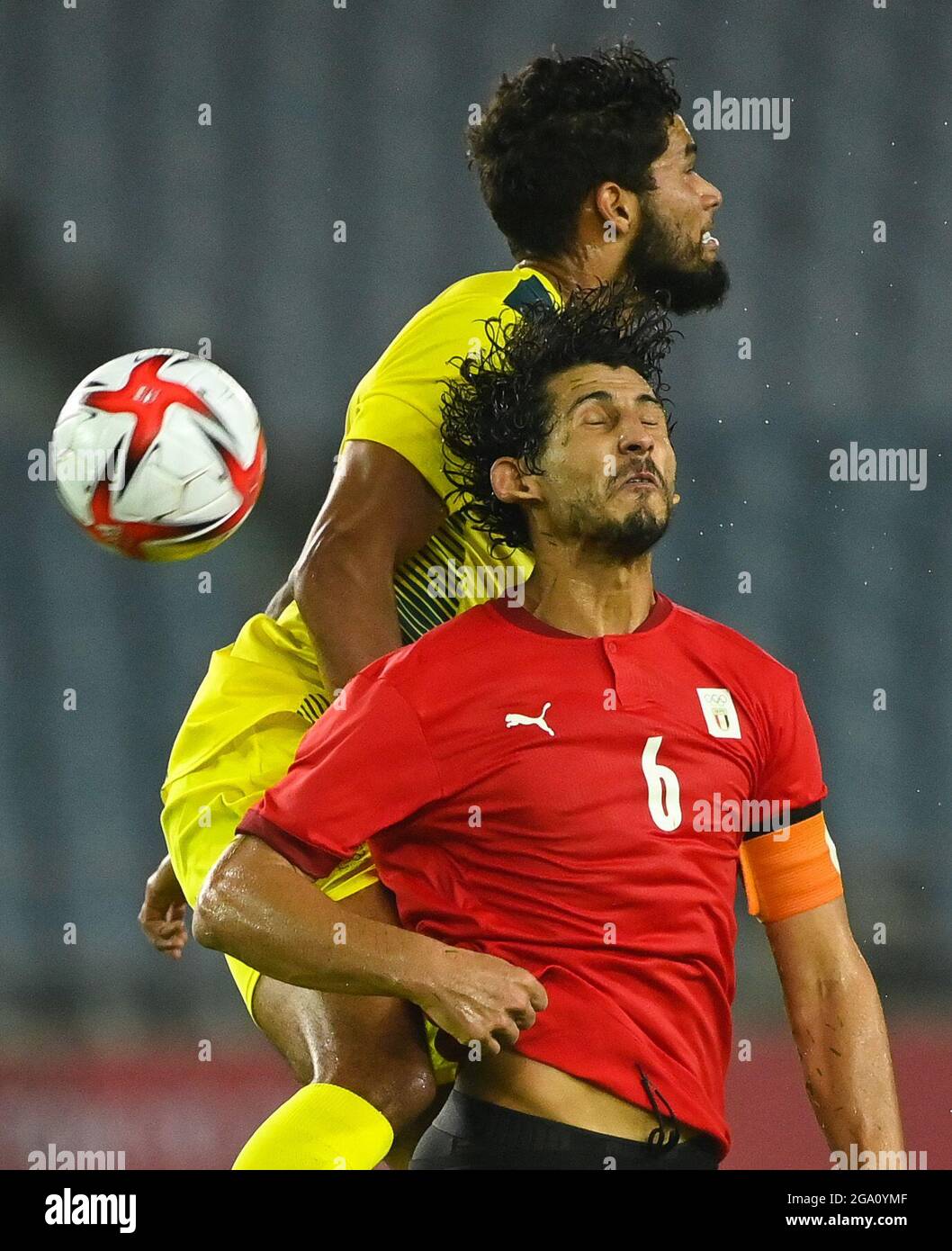 Miyagi, Japan. 28th July, 2021. Ahmed Hegazy (bottom) of Egypt vies with Jay Rich-Baghuelou of Australia during the men's group C football match between Australia and Egypt at the Tokyo 2020 Olympic Games in Miyagi, Japan, July 28, 2021. Credit: Lu Yang/Xinhua/Alamy Live News Stock Photo