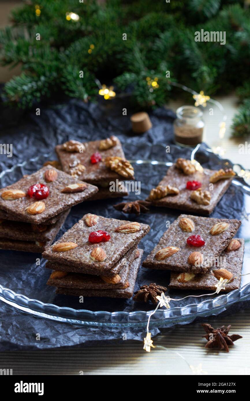 Chocolate chip cookies with almonds and cherries in the form of playing cards. Stock Photo
