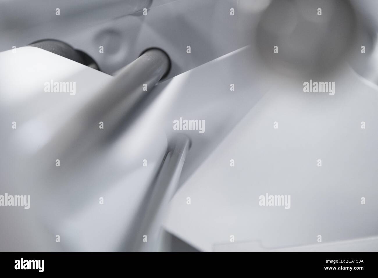 Close up of stainless steel printer machine parts. Softness, simplicity. Stock Photo