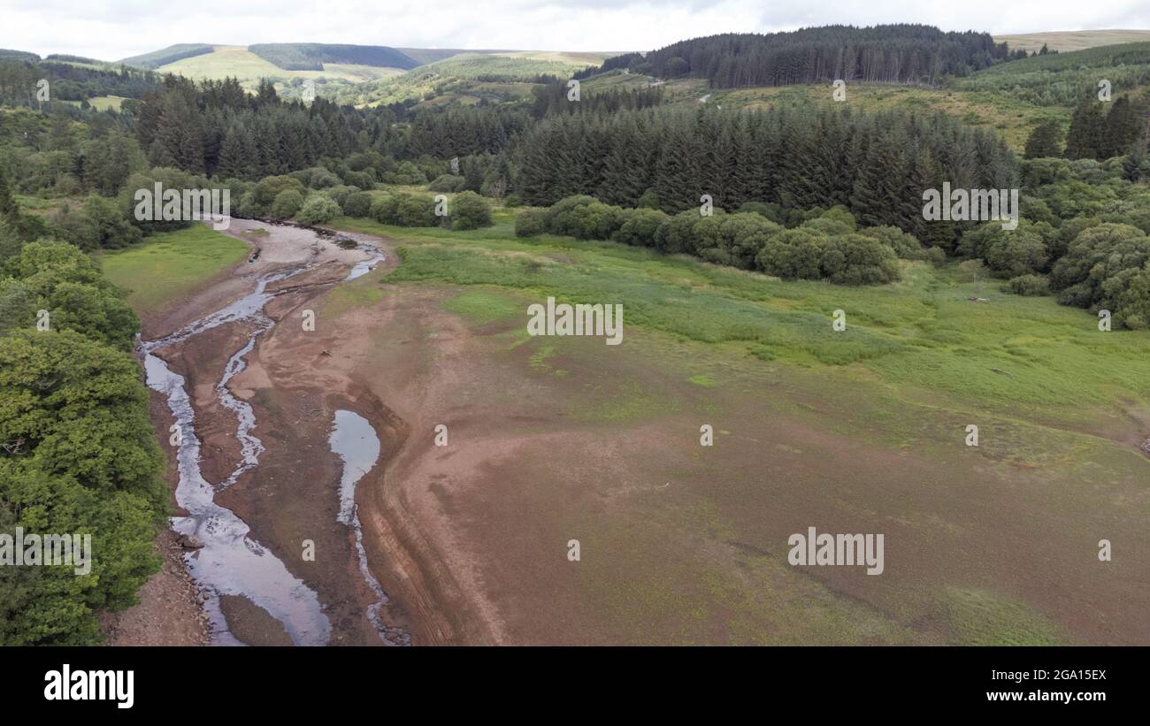 Llwyn Onn reservoir, Merthyr Tydfil, South Wales. 28 July 2021. Water levels remain low at the reservoir after the heatwave. Credit: Andrew Bartlett/Alamy Live News. Stock Photo