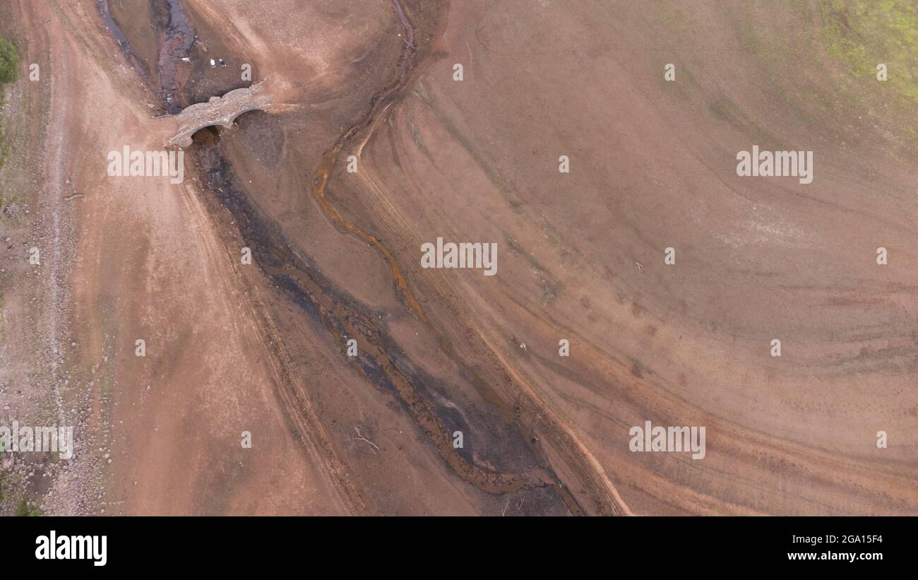 Llwyn Onn reservoir, Merthyr Tydfil, South Wales. 28 July 2021. Water levels remain low at the reservoir after the heatwave. Credit: Andrew Bartlett/Alamy Live News. Stock Photo